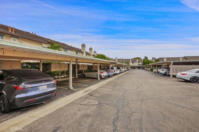 11 Exeter, Irvine, CA 92612 - covered parking lot featuring a residential view