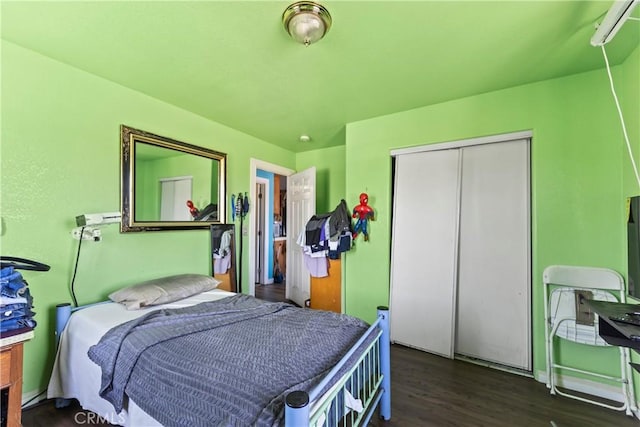 730 W 52nd Pl, Los Angeles, CA 90037 - bedroom featuring wood finished floors and a closet