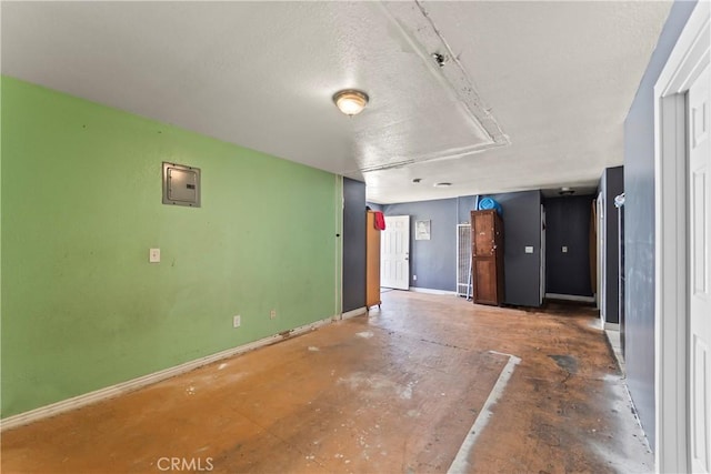 730 W 52nd Pl, Los Angeles, CA 90037 - unfurnished living room with electric panel and baseboards