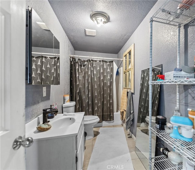 730 W 52nd Pl, Los Angeles, CA 90037 - full bathroom with vanity, a textured ceiling, tile patterned flooring, a textured wall, and shower / tub combo