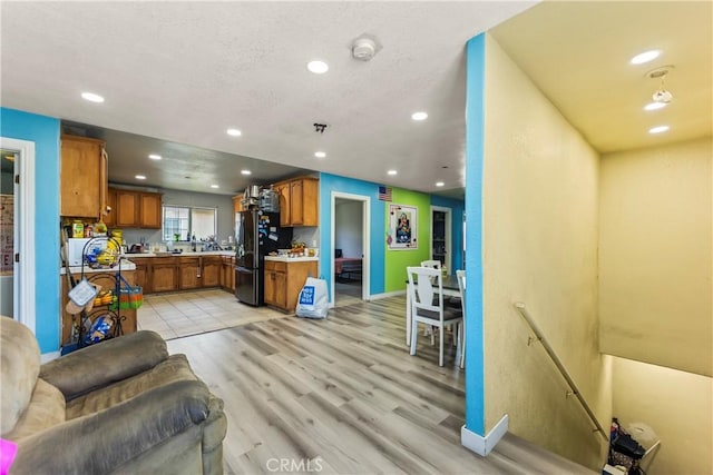 730 W 52nd Pl, Los Angeles, CA 90037 - living area with recessed lighting and light wood-style floors