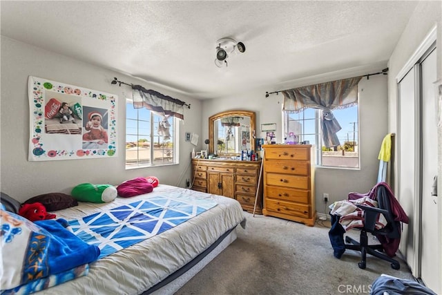 730 W 52nd Pl, Los Angeles, CA 90037 - carpeted bedroom featuring a textured ceiling