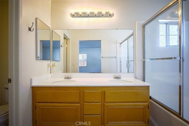 3087 Arbor Glen Ct, Corona, CA 92879 - full bath with double vanity and shower / bath combination with glass door
