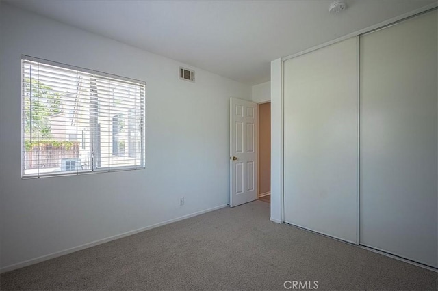 3087 Arbor Glen Ct, Corona, CA 92879 - unfurnished bedroom featuring a closet and carpet