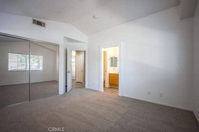 3087 Arbor Glen Ct, Corona, CA 92879 - unfurnished bedroom with light colored carpet, vaulted ceiling, a closet, and ensuite bathroom