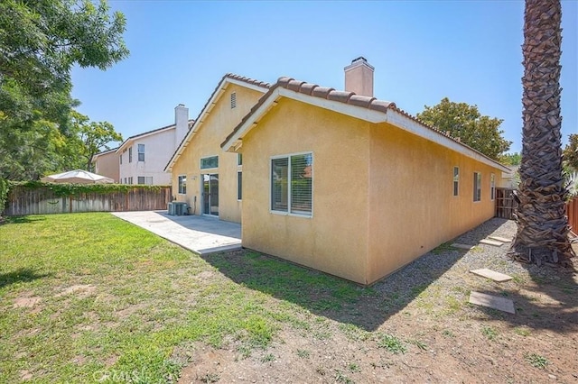 3087 Arbor Glen Ct, Corona, CA 92879 - back of house featuring a chimney, a patio, stucco siding, a fenced backyard, and a tile roof