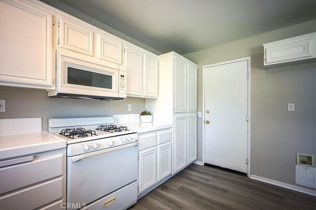 3087 Arbor Glen Ct, Corona, CA 92879 - kitchen with white appliances, tile countertops, dark wood-style flooring, and white cabinetry