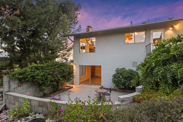 5240 Ramsdell Ave, La Crescenta, CA 91214 - view of front of home featuring stucco siding, a patio area, and a chimney