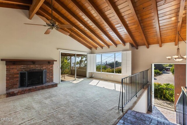 5240 Ramsdell Ave, La Crescenta, CA 91214 - unfurnished living room featuring a wood ceiling with exposed beams, healthy amount of natural light, carpet flooring, a chandelier, and a brick fireplace