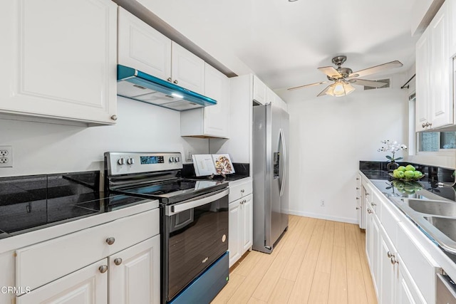 4722 Park Granada Unit 206, Calabasas, CA 91302 - kitchen with stainless steel appliances, under cabinet range hood, white cabinetry, a ceiling fan, and light wood-style floors