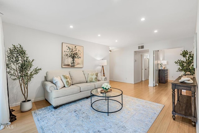 4722 Park Granada Unit 206, Calabasas, CA 91302 - living room with light wood finished floors and recessed lighting