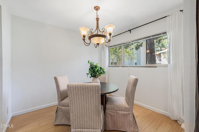 4722 Park Granada Unit 206, Calabasas, CA 91302 - dining room featuring a chandelier and wood finished floors