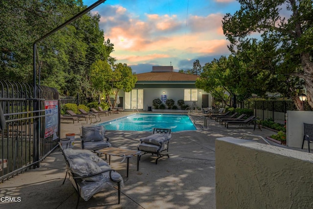 4722 Park Granada Unit 206, Calabasas, CA 91302 - pool at dusk with a patio area and a community pool