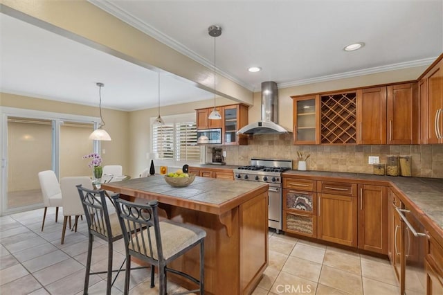 4441 Avocado Ave, Yorba Linda, CA 92886 - kitchen with stainless steel appliances, wall chimney range hood, brown cabinetry, a kitchen breakfast bar, and crown molding