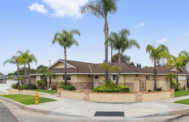 4441 Avocado Ave, Yorba Linda, CA 92886 - ranch-style house with stone siding and a gate