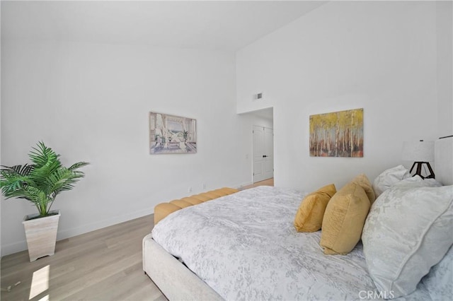 35 Havenwood Unit 83, Irvine, CA 92614 - bedroom featuring wood finished floors and high vaulted ceiling