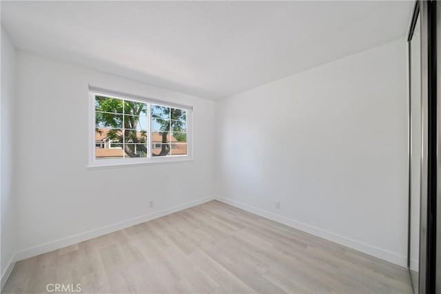 35 Havenwood Unit 83, Irvine, CA 92614 - unfurnished room with light wood finished floors and baseboards