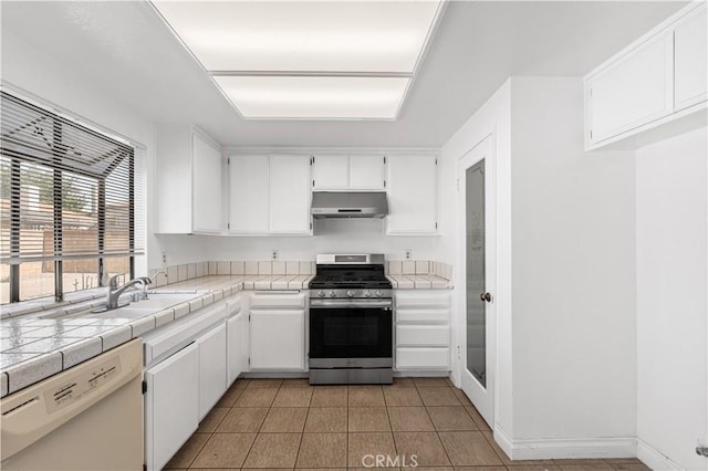 37756 45th, Palmdale, CA 93552 - kitchen with gas stove, ventilation hood, dishwasher, tile countertops, and white cabinets