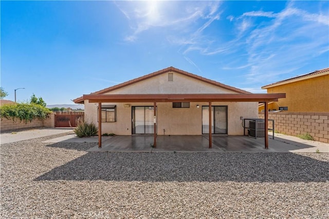 37756 45th, Palmdale, CA 93552 - back of house featuring a fenced backyard, a patio area, and stucco siding