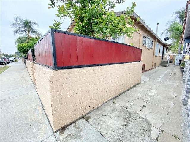 218 E 60th St, Los Angeles, CA 90003 - view of property exterior with stucco siding and a patio