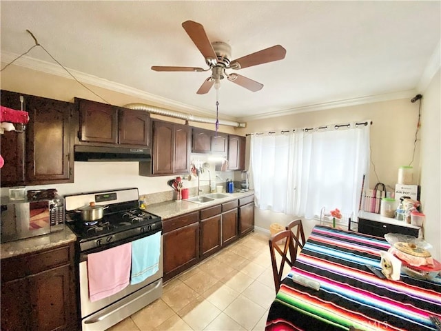218 E 60th St, Los Angeles, CA 90003 - kitchen with stainless steel range with gas stovetop, under cabinet range hood, crown molding, ceiling fan, and dark brown cabinetry