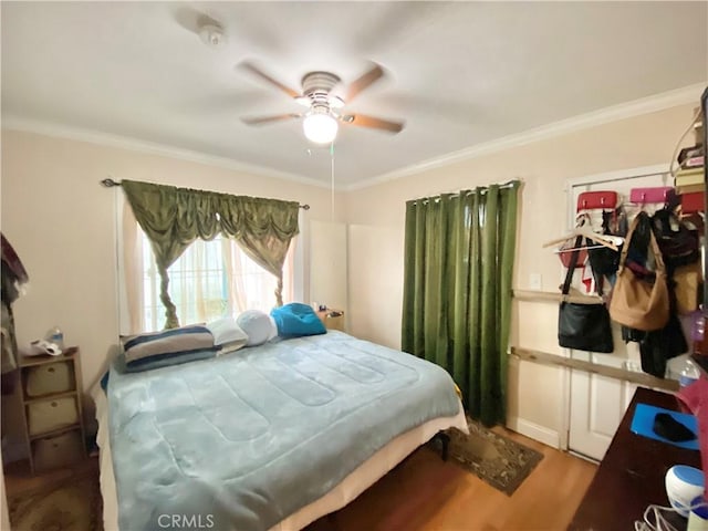 218 E 60th St, Los Angeles, CA 90003 - bedroom featuring ornamental molding, wood finished floors, and ceiling fan