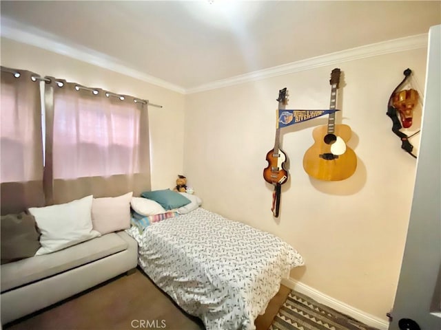 218 E 60th St, Los Angeles, CA 90003 - bedroom featuring crown molding and baseboards