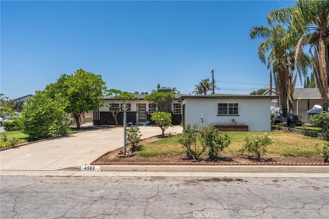 4503 N Glenvina Ave, Covina, CA 91722 - single story home featuring stucco siding, concrete driveway, and a front lawn