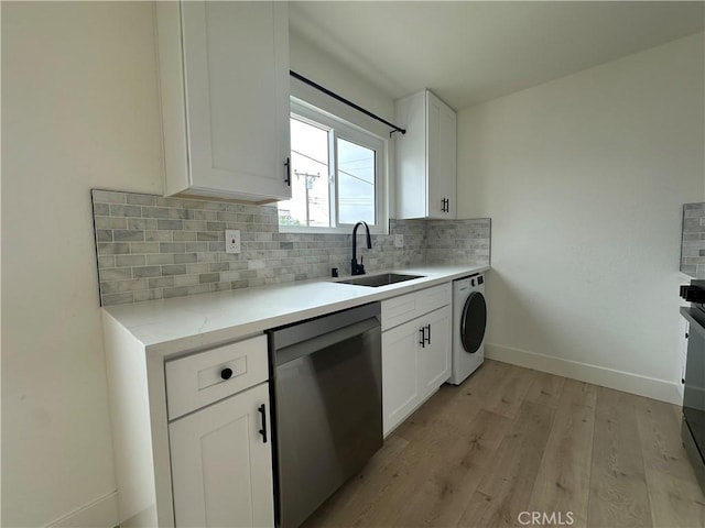 17412 Dairyview Cir Unit D, Huntington Beach, CA 92647 - kitchen with stainless steel dishwasher, washer / clothes dryer, backsplash, light wood finished floors, and white cabinets