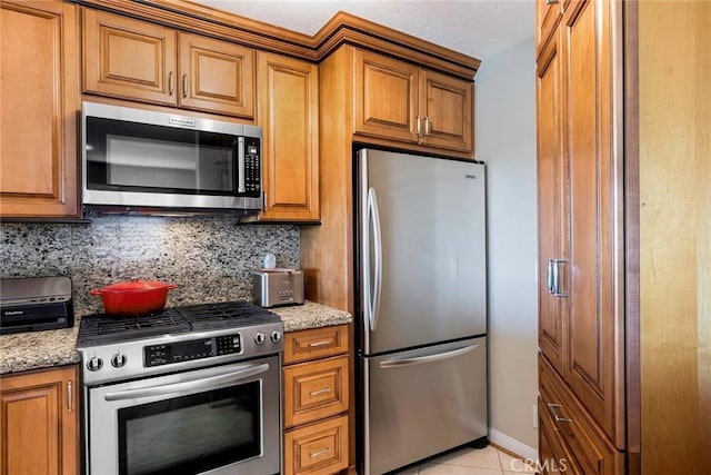 3811 E Livingston Dr Unit 1, Long Beach, CA 90803 - kitchen with stainless steel appliances and brown cabinets