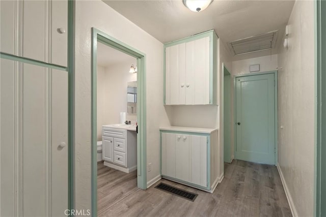 1220 Bidwell Ave, Chico, CA 95926 - hallway with light wood finished floors and attic access