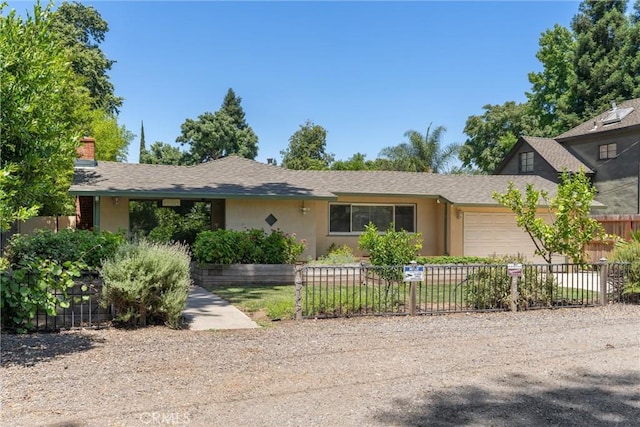 1220 Bidwell Ave, Chico, CA 95926 - ranch-style house featuring stucco siding, an attached garage, and a chimney