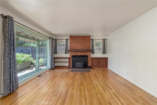 1220 Bidwell Ave, Chico, CA 95926 - unfurnished living room featuring light wood finished floors and healthy amount of natural light