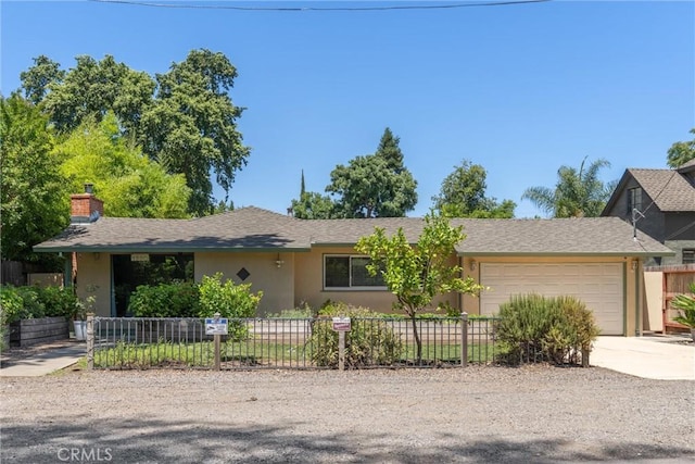 1220 Bidwell Ave, Chico, CA 95926 - ranch-style house featuring concrete driveway, an attached garage, stucco siding, and a chimney