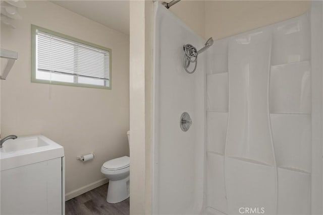 1220 Bidwell Ave, Chico, CA 95926 - bathroom featuring vanity, a shower, and wood finished floors
