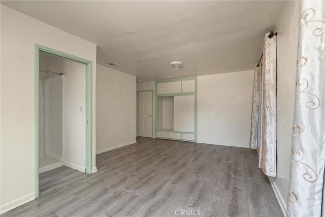 1220 Bidwell Ave, Chico, CA 95926 - unfurnished bedroom with wood finished floors and baseboards