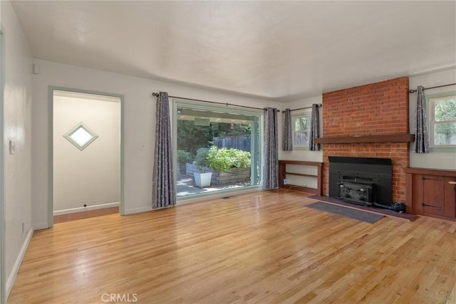 1220 Bidwell Ave, Chico, CA 95926 - unfurnished living room featuring wood finished floors and baseboards