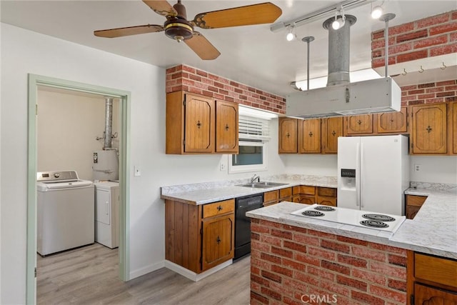 1220 Bidwell Ave, Chico, CA 95926 - kitchen featuring white appliances, washer and clothes dryer, brown cabinetry, and light wood finished floors