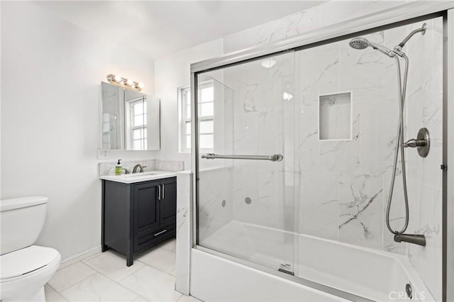 9912 Marshall St, El Monte, CA 91731 - bathroom featuring vanity, marble look tile flooring, and shower / bath combination with glass door