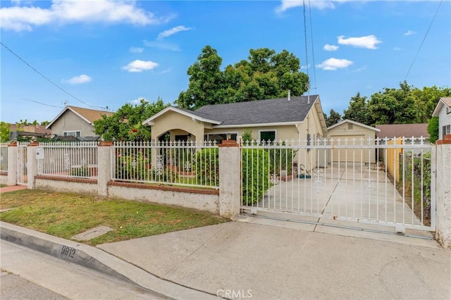 9912 Marshall St, El Monte, CA 91731 - view of front facade with a detached garage, a fenced front yard, stucco siding, and a gate
