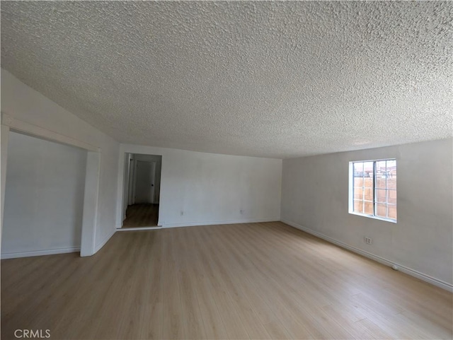 10051 Orchard St, Bloomington, CA 92316 - spare room with light wood-style flooring and a textured ceiling