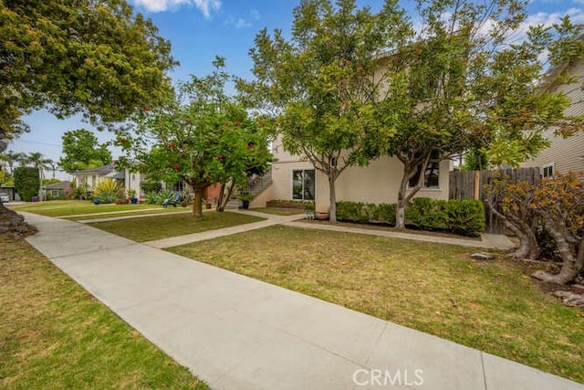 338 Prospect Ave, Long Beach, CA 90814 - view of property hidden behind natural elements featuring stairway and stucco siding