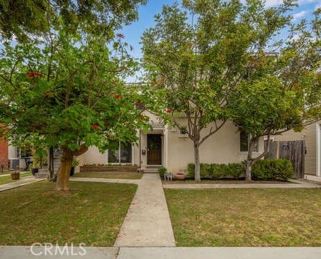 338 Prospect Ave, Long Beach, CA 90814 - view of property hidden behind natural elements featuring stucco siding