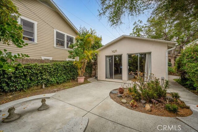 338 Prospect Ave, Long Beach, CA 90814 - rear view of house with a patio area and stucco siding