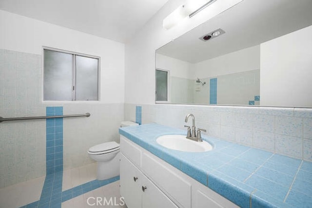 338 Prospect Ave, Long Beach, CA 90814 - bathroom featuring tile walls, vanity, a shower, and tile patterned flooring