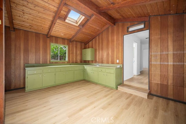 338 Prospect Ave, Long Beach, CA 90814 - kitchen with green cabinetry, a skylight, light wood-type flooring, wooden ceiling, and wooden walls