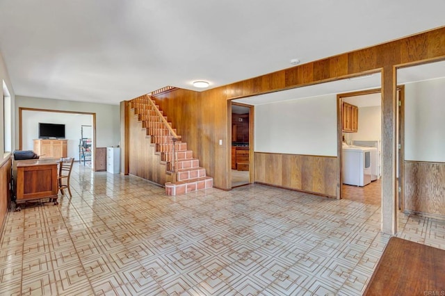 2702 Country Club Dr, Escondido, CA 92029 - unfurnished living room with wooden walls, washer / dryer, stairway, and wainscoting