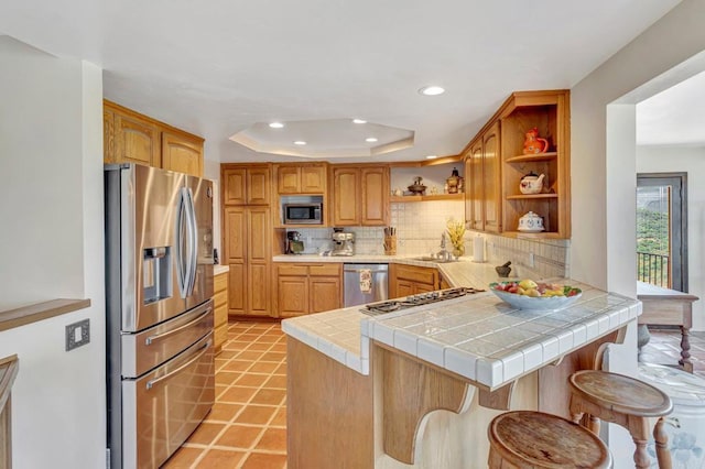 2702 Country Club Dr, Escondido, CA 92029 - kitchen featuring stainless steel appliances, open shelves, a peninsula, decorative backsplash, and recessed lighting