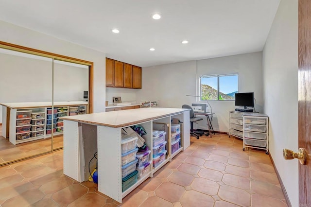 2702 Country Club Dr, Escondido, CA 92029 - kitchen with brown cabinets, a desk, recessed lighting, light countertops, and a kitchen island