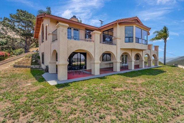 2702 Country Club Dr, Escondido, CA 92029 - back of house with a balcony, stucco siding, a patio, a yard, and a tiled roof
